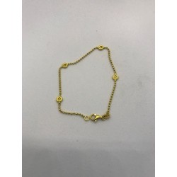 Pulsera de oro 18 kts en oro amarillo, con forma de bolitas y 4 circonitas