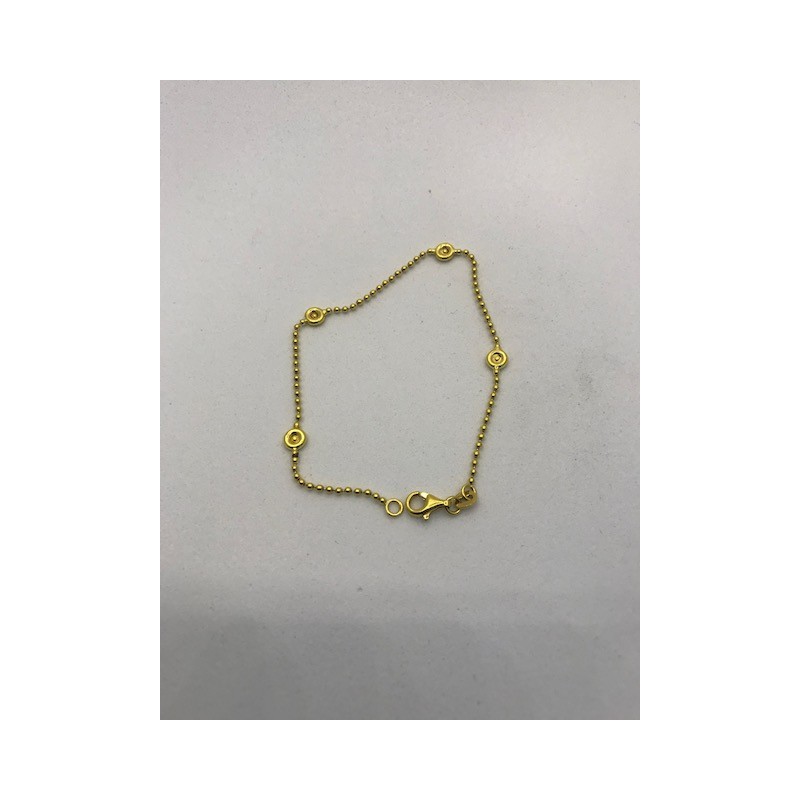 Pulsera de oro 18 kts en oro amarillo, con forma de bolitas y 4 circonitas